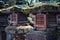 Wooden lanterns covered by moss in Nara Japan