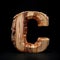 Wooden letter C. Wood font made of sticks, bark and wood. Forest typographic symbol.