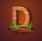 Wooden letter `D` decorated with grass