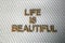 Wooden letter forming the words Life Is Beautiful