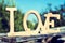 Wooden letters forming the word love in a rustic scenery