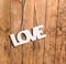 Wooden letters forming word LOVE written on wooden background