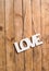 Wooden letters forming word LOVE written on wooden background