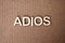 Wooden letters forming the words Adios in Spanish