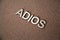 Wooden letters forming the words Adios in Spanish