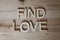 Wooden letters making the words Find Love