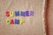 Wooden letters with phrase: SUMMER CAMP, and rope