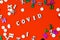 The wooden letters are the word covid. Concept on the theme of flu, virus.