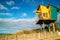 Wooden lifeguard observation tower on sandy beach in Lakes Entrance.