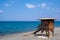 Wooden lifeguard safety station against blue water and sky