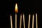 Wooden lighted matches, standing on a black background