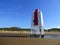 Wooden lighthouse and sand dunes