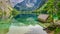 Wooden little cottage on the blue lake Obersee in Alps