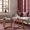 Wooden living room in red and beige tones, close-up. Fabric sofa, rattan capet, coffee tables and curtains. Japandi farmhouse