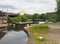 Wooden lock gates on the calder hand hebble navigation canal in front of the basin in sowerby bridge west yorkshire surrounded by