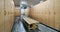 Wooden lockers with a wood bench in a locker room