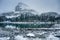 Wooden lodge in pine forest with heavy snow reflection on Lake O\'hara at Yoho national park