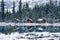 Wooden lodge in pine forest with heavy snow reflection on Lake O\'hara at Yoho national park