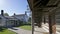 Wooden log cabin front porch and the building exterior of a historic house