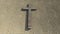 Wooden logg cross on a stone pavement background. 3d illustration metaphor for God, Christ, Christianity