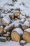 Wooden logs covered in snow