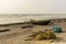 A wooden lonely fishing boat with fishing net on Digha sea beach. Selective focus