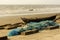 A wooden lonely fishing boat with fishing net on Digha sea beach. Selective focus