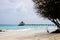 Wooden long bridge in beautiful loneliness beach ocean