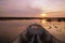 Wooden Longtail Boat Nose at Sunrise. Front View at Thale Noi Waterfowl Reserve Lake, Thailand