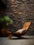 Wooden lounge chair near wild stone cladding wall