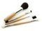 Wooden makeup brushes isolated on white background. Set of powder brush, eye brush, lip brush and eyebrow brush. Makeup kit.