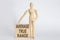 Wooden man shows with a hand text average true range on wooden block