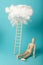 Wooden man and stepladder in clouds, career challenge and achievement. Progress and dream