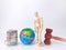 Wooden mannequin banknotes,earth globe and gavel