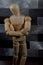 Wooden mannequin with crossed arms - vertical shot