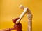 Wooden mannequin and gavel on a yellow background - Law concept