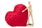 Wooden mannequin with a gigantic soft red heart