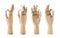 Wooden mannequin hands signing OK on white background. Different angles