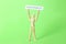 Wooden mannequin holding card with word Responsibility on light green background