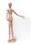 Wooden mannequin holds in hand a blank paper sheet on w