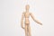 wooden mannequin object close up light background