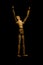 Wooden mannequin raising hands to light isolated