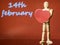 Wooden mannequin with red heart on red color background and 14th ferbuary blurred sing in the background, Saint Valentine theme