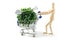 Wooden mannequin shopping garden utensils in a shopping cart at