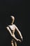Wooden mannequin to learn how to draw the human body in a position of movement