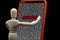 wooden mannequin touching a smartphone with the word Password on screen