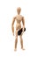 Wooden mannikin standing and holding fingerboard mini skateboard.