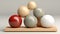 A wooden and marble spheres of different sizes and colors in an orderly arrangement