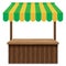 Wooden market stall with green and yellow awning.