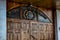 Wooden massive door with a sign and logo of the International Police Association in Kharkov. The